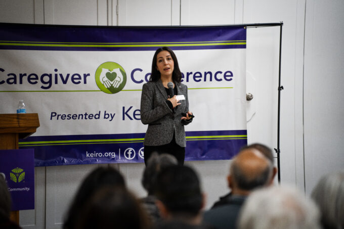 Roxy Kirakosyan speaking on stage with microphone