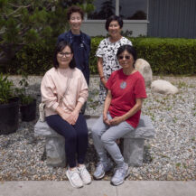 four women sitting together