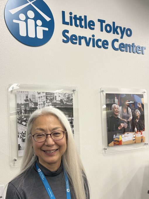 woman smiling in front of Little Tokyo Service Center sign