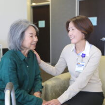 woman talking to Iyashi Care social worker