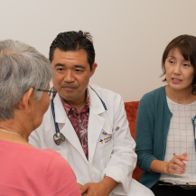 Iyashi Care team talking to a patient