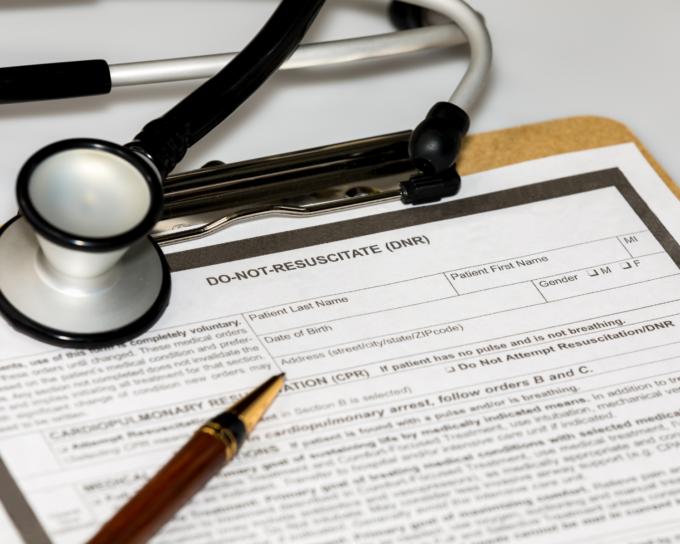 stethoscope with paper that reads Do Not Resuscitate