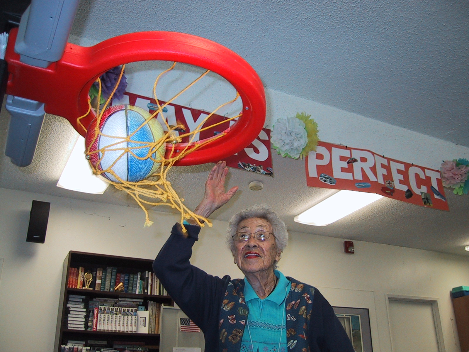 older adult shooting a hoop