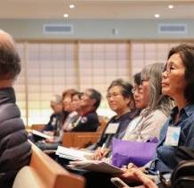attendees listening to presentation at caregiver conference