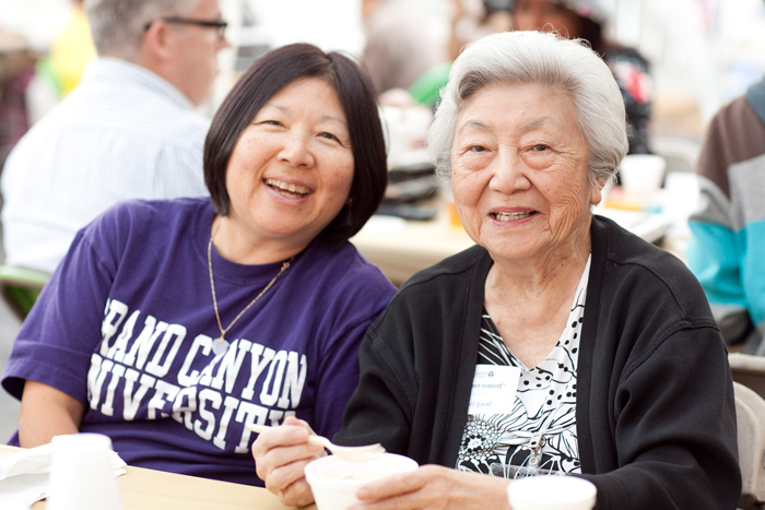 Two adult women sitting together