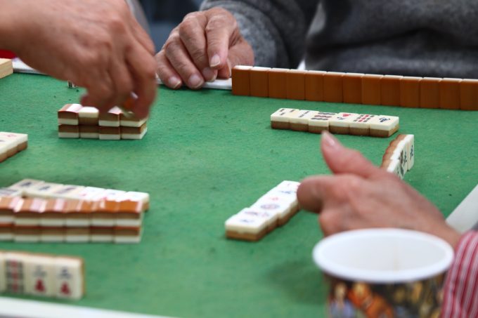 older adults playing mahjong