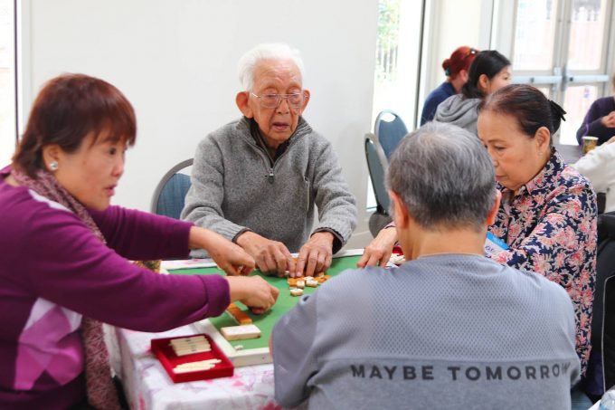 christ episcopal church social gathering where older adults are playing mahjong
