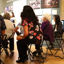 JANM docents and volunteers going through training with chairs