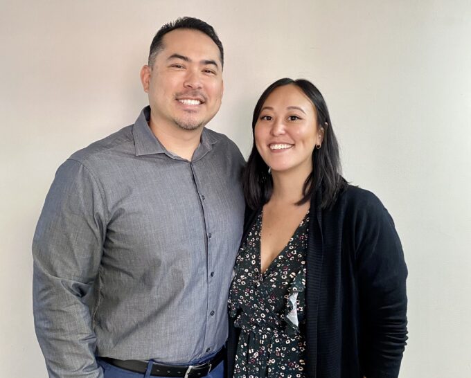 man and woman smiling