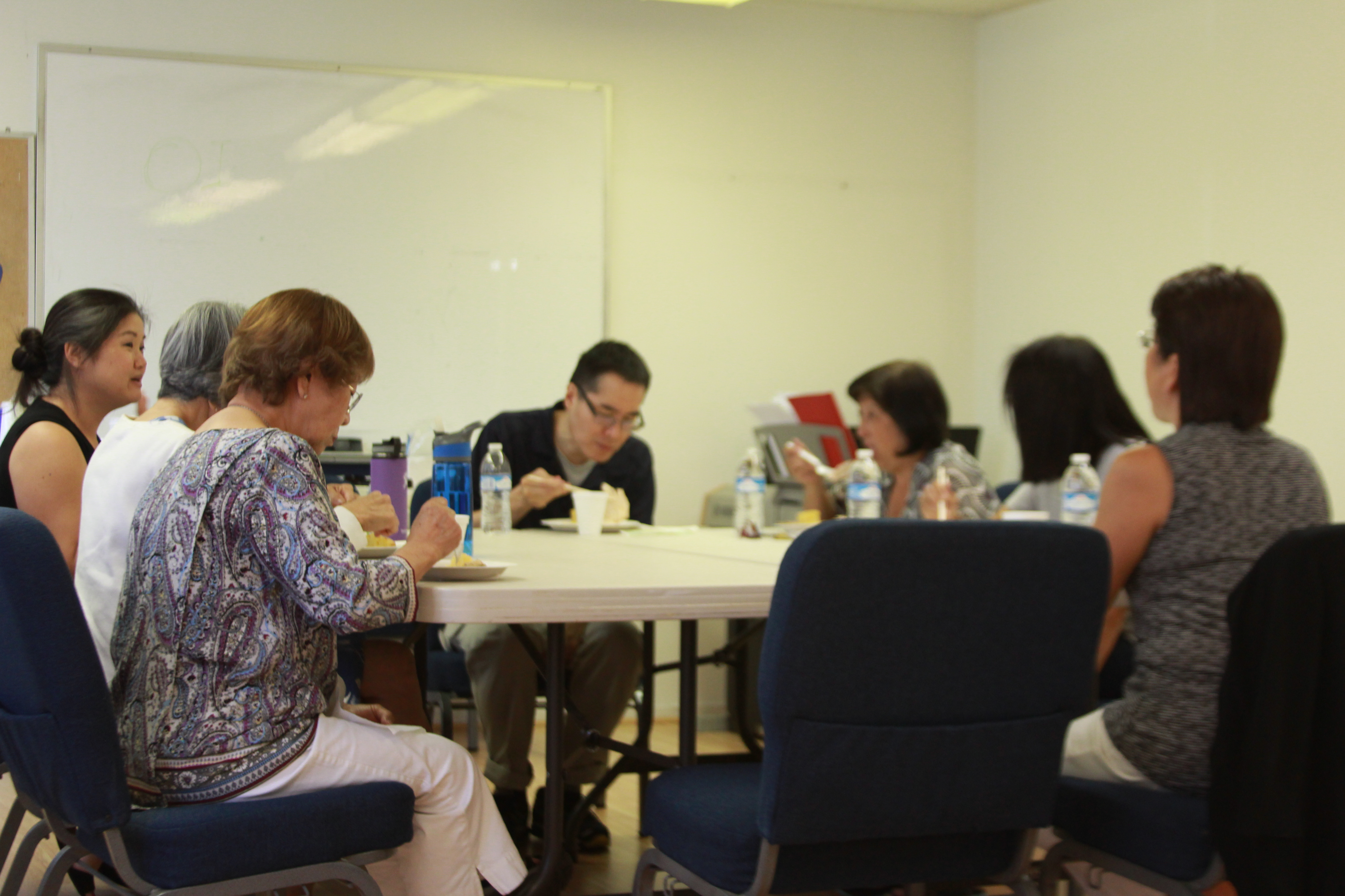 Caregiver support group participants eating lunch together