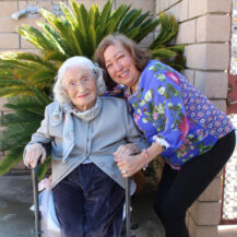 two women posing for photo