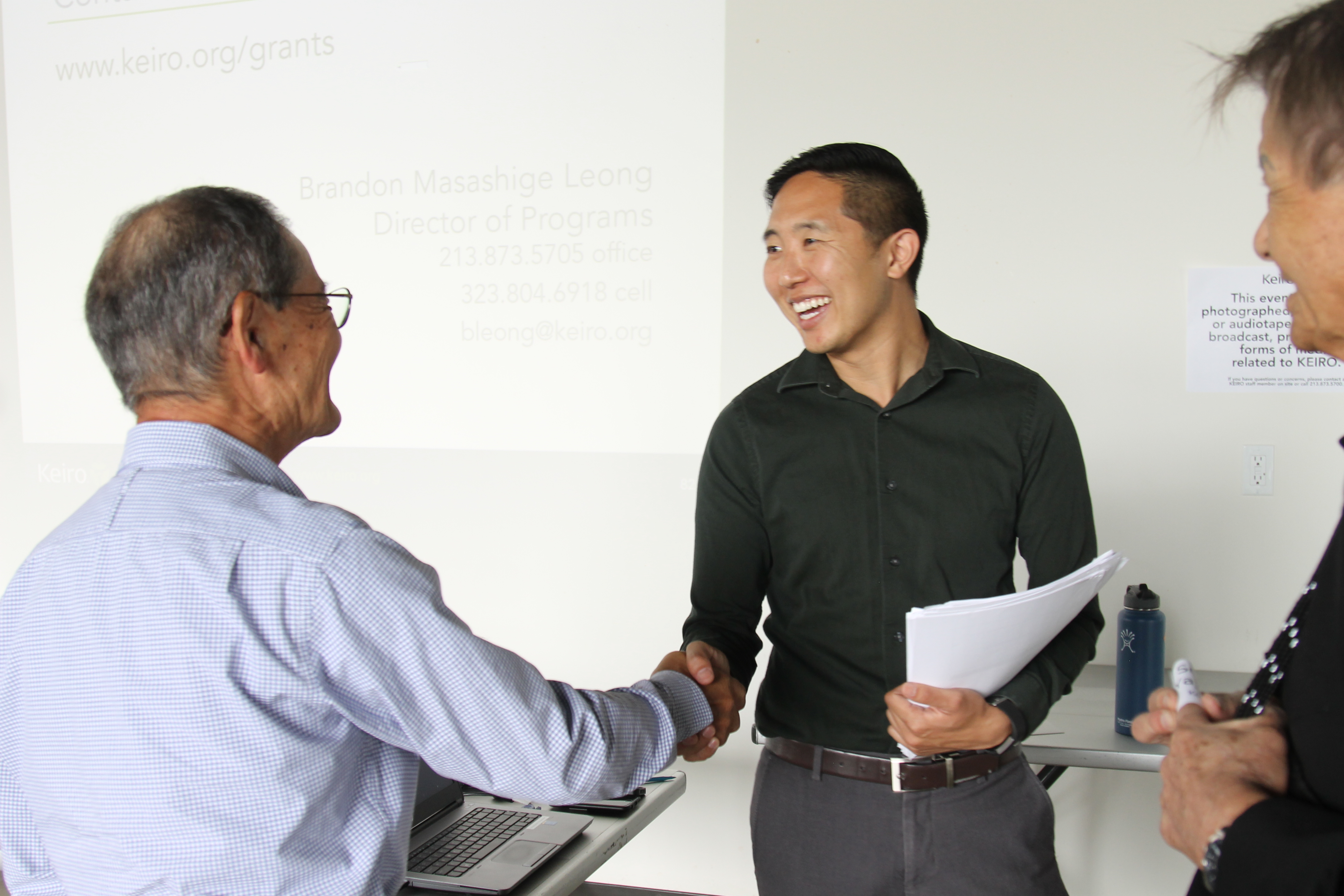 Adult men shaking hands