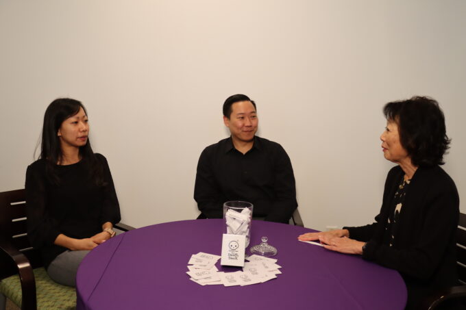 group conversating at purple table