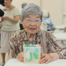 Older woman holding her homemade lantern