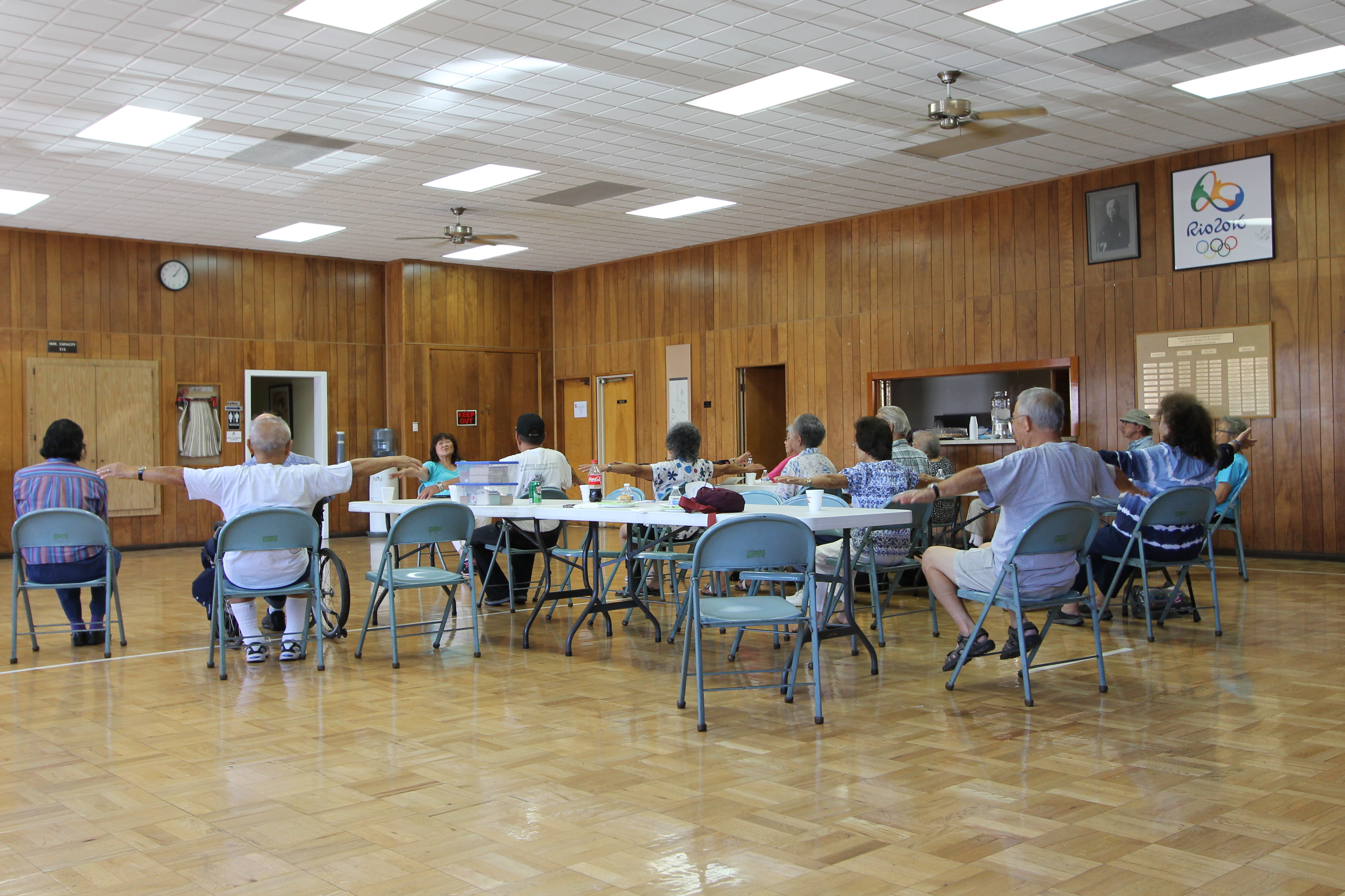 Older adults participate in a group physical activity