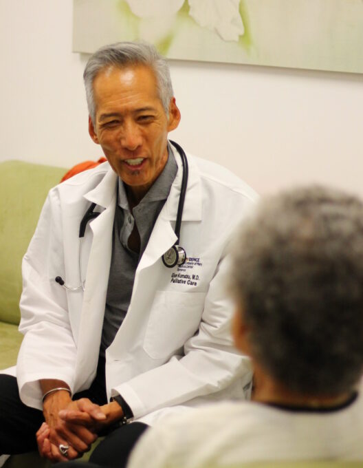 doctor talking to older adult