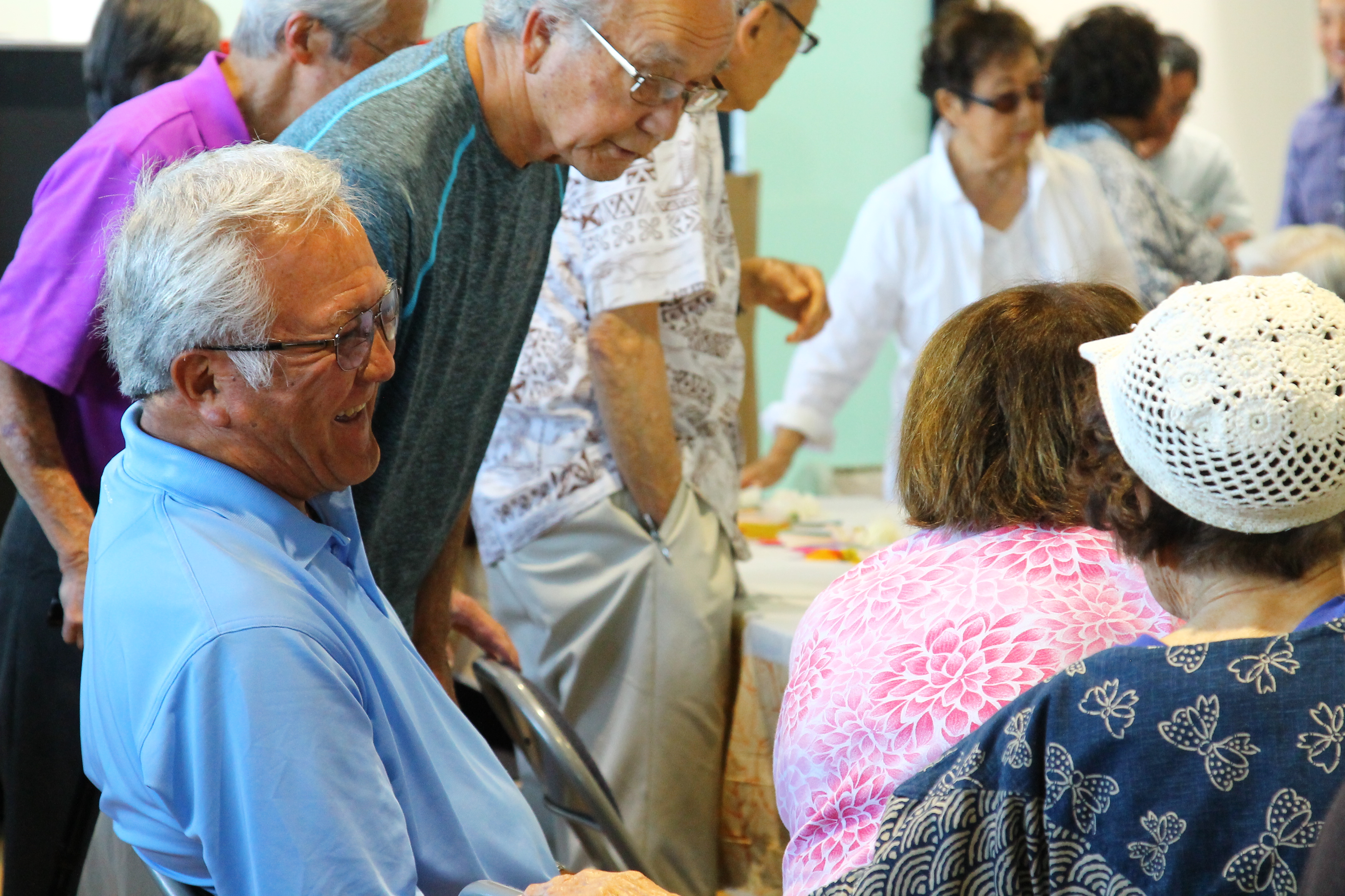 Older adults sitting at a table together