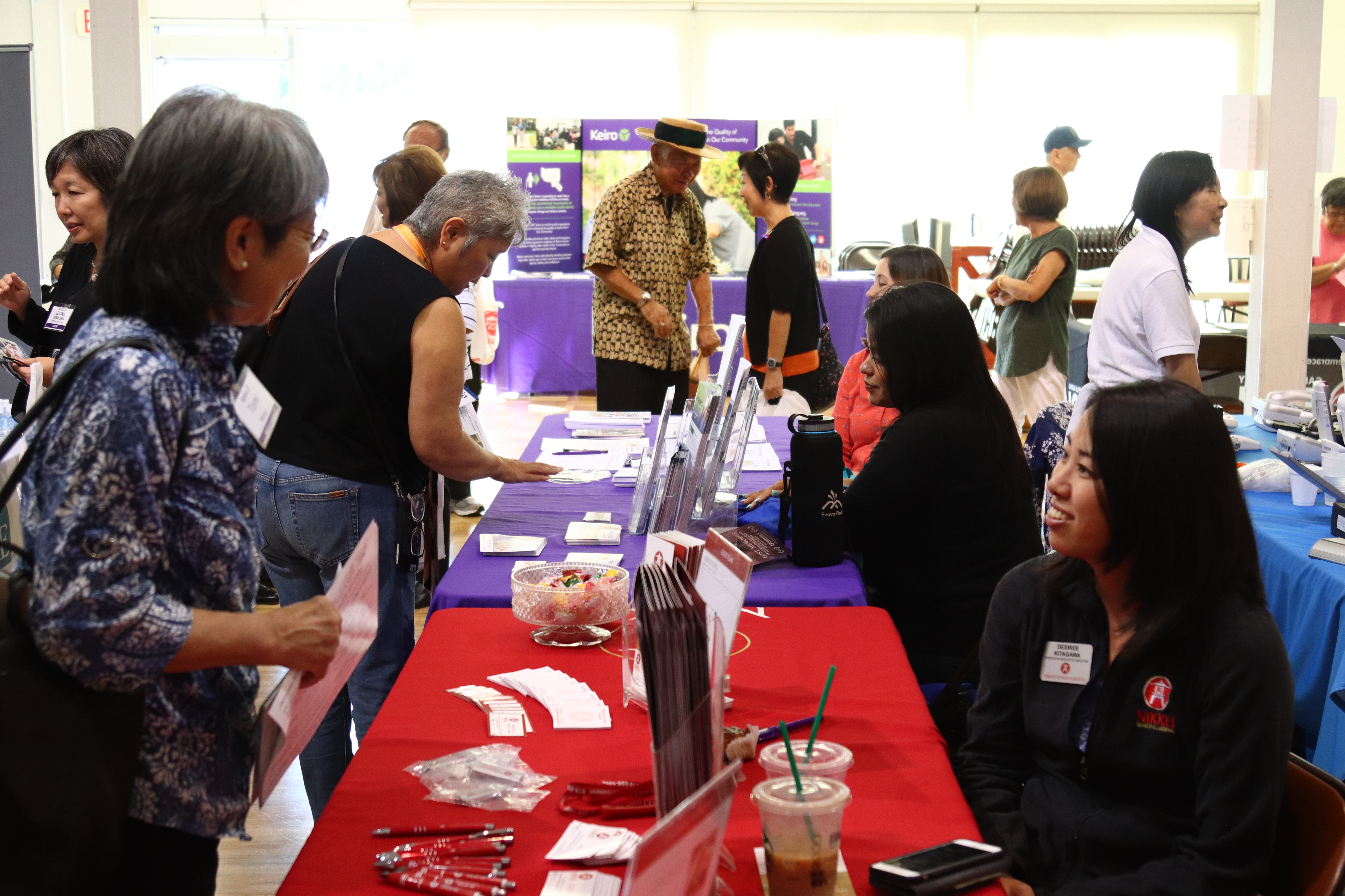 Conference attendees visit exhibition booths