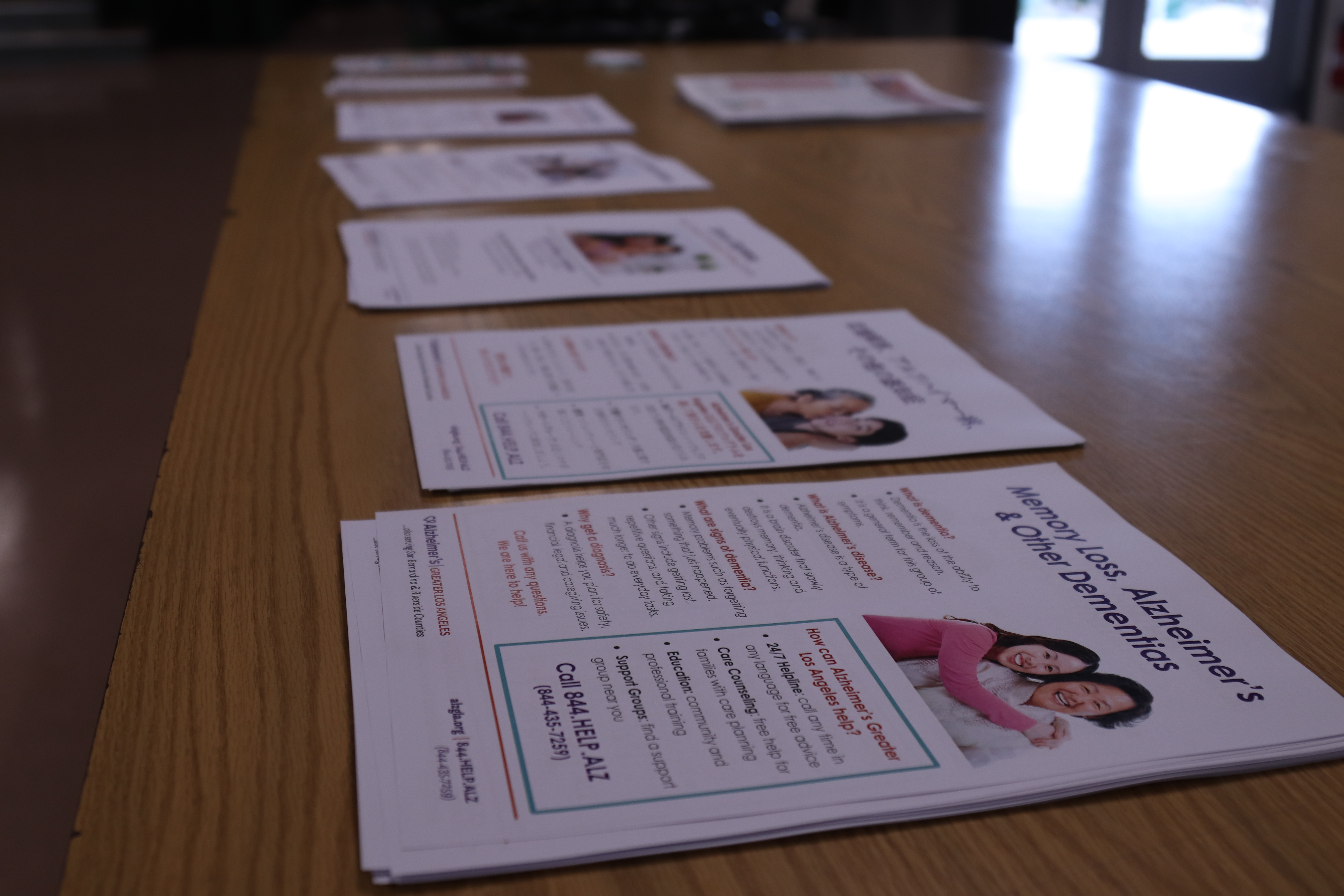 Small piles of flyers about memory loss on a table