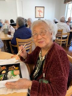 woman eating bento