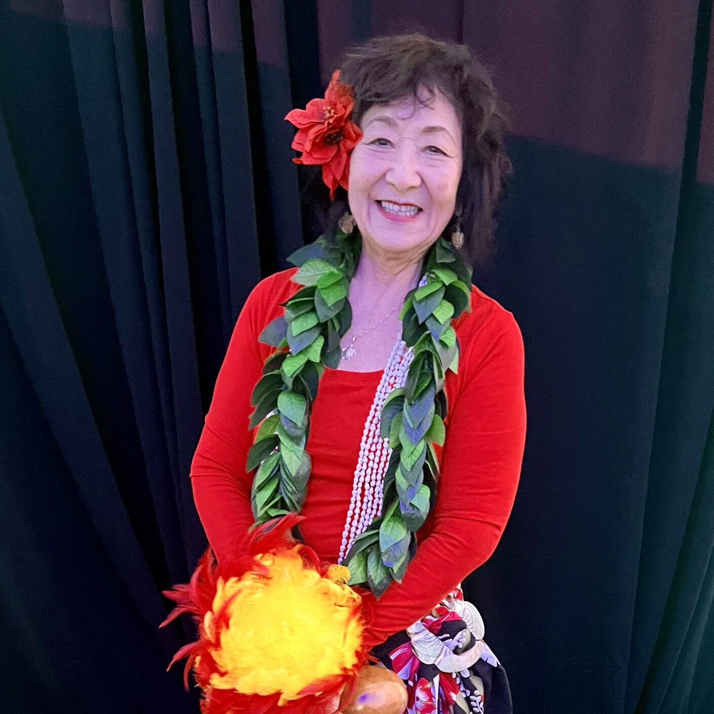 woman smiling wearing hula outfit