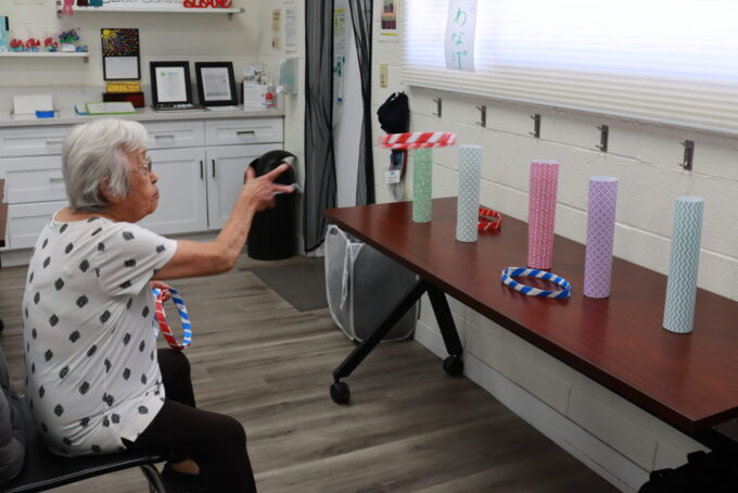 woman playing ring toss