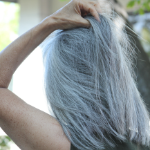 woman pulling back hair