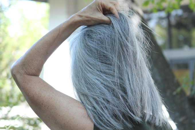 woman pulling back hair