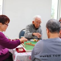 older adults playing mahjong