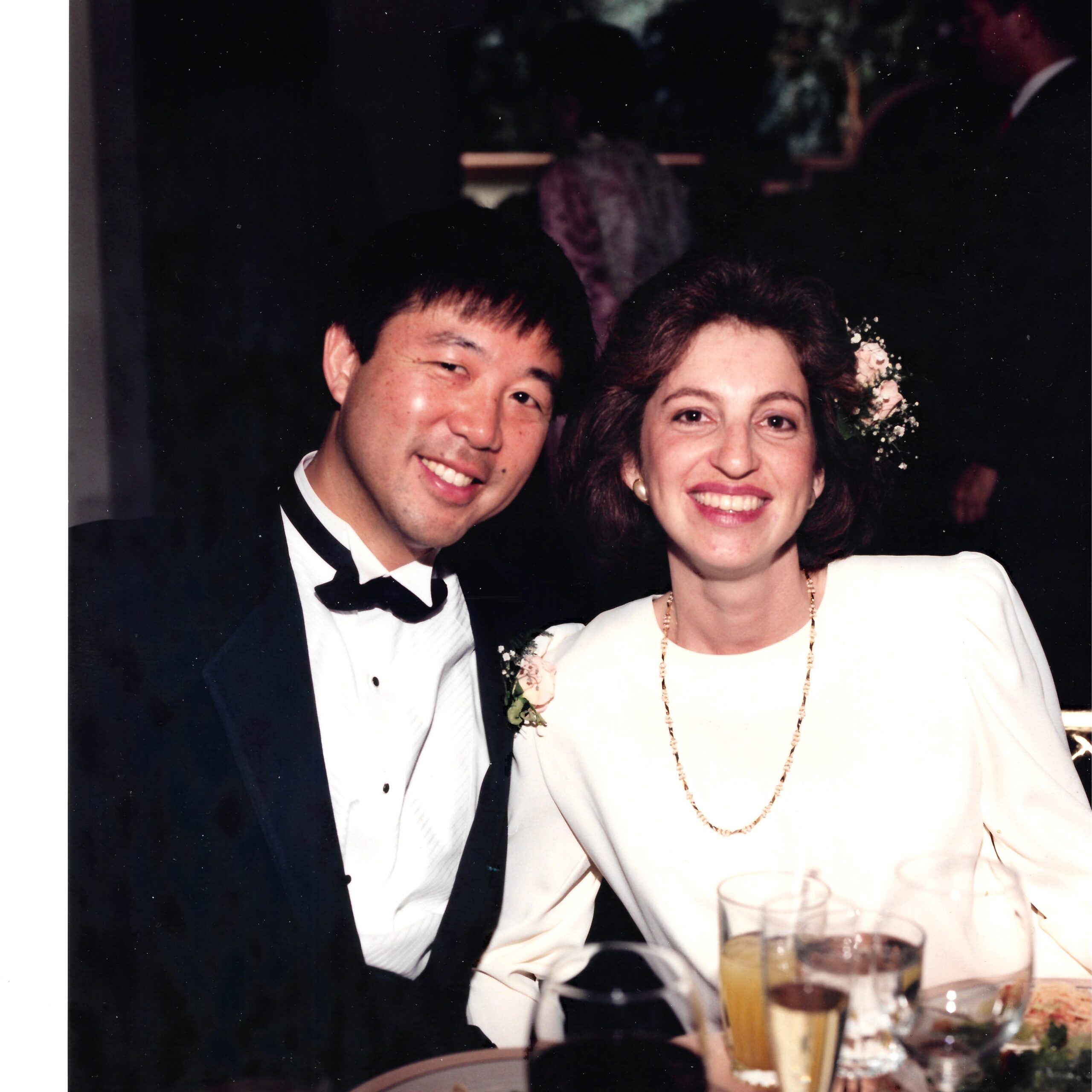 wedding photo of man in tux and woman in white dress
