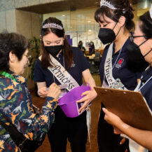 nisei week court talking to a woman