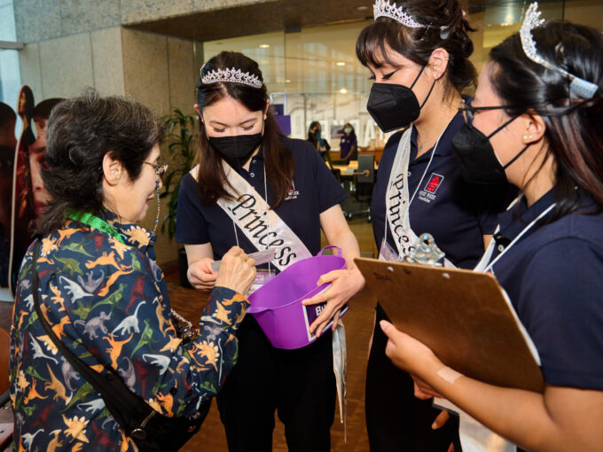 nisei week court talking to a woman