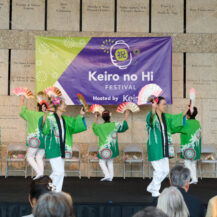 women dancing holding fans