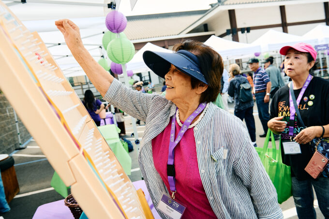 woman playing plinko