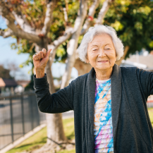 older adults putting hands up