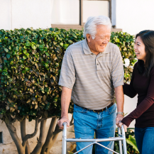 older adult and caregiver looking at each other