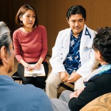 iyashi care team listening to a patient and caregiver