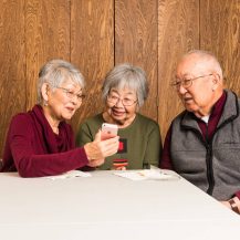 older adults looking into smartphone