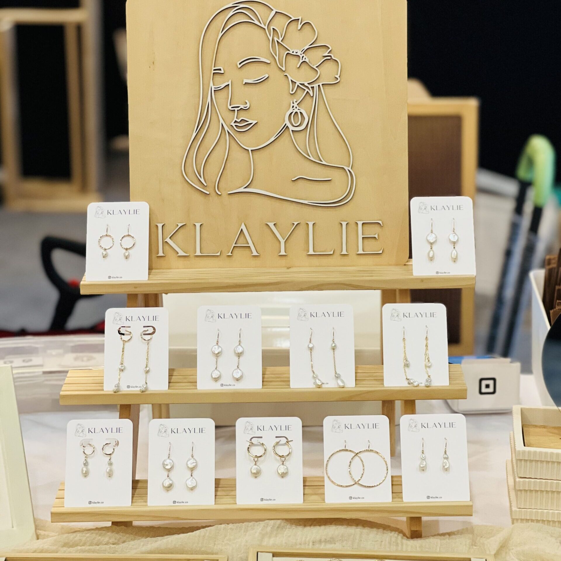assorted jewlery with a sign that says "Klaylie"