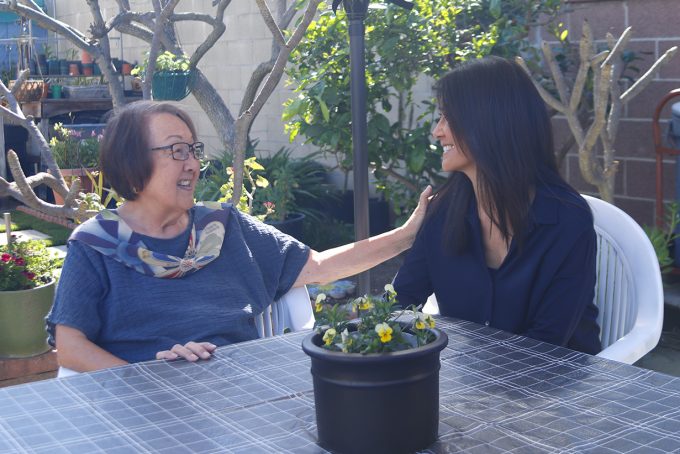 joanne and terri talking at table