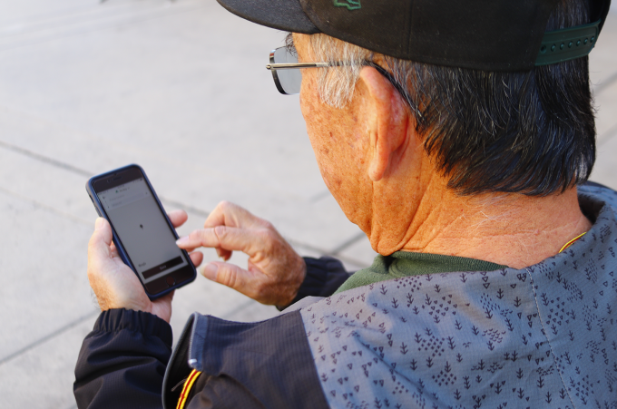 man looking at phone