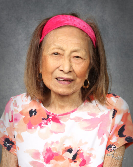 portrait of older woman in pink