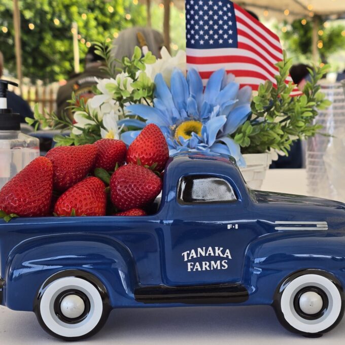 small blue truck centerpiece with strawberries in bed
