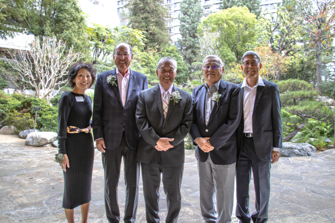 group photo of four people outside