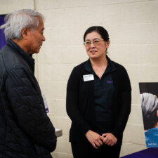 Keiro staff talking to conference attendee