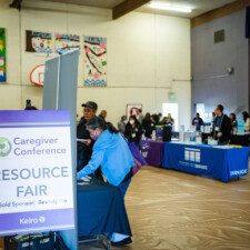 Resource fair sign with tables in the background