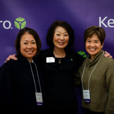 Beverly Ito with two conference attendees smiling with Keiro backdrop