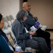 conference attendee reading brochure