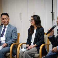Tomohiro J. Kagami, Mei Kameda, and Makoto Kotani on stage