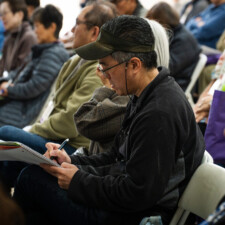 conference attendee taking notes
